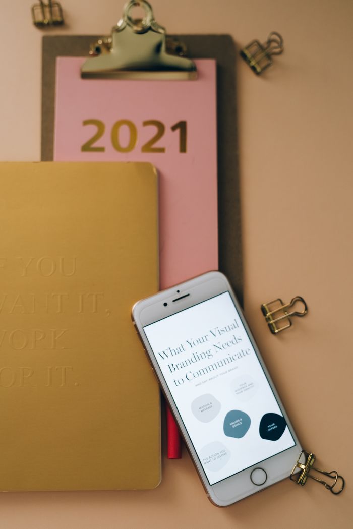 Mastering the First Impression: Your intriguing post title goes here Stylish office setup featuring a 2021 calendar, smartphone, and stationery on a desk.